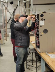 Josh working on an HVAC training unit