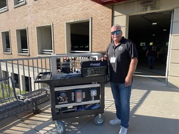 Johnny Monroy, Director of Training at the UA Local 250 in Los Angeles, standing with his iConnect Training HVACR trainers